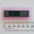 Top view of Intel P8255A-5 integrated circuit on foam next to a metric ruler.