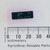 Fairchild 7404PC 14-pin DIP IC shown with a millimeter ruler.