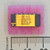 Top view of Analog Devices 582KD integrated circuit with gold lid on pink foam.