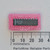 Maxim MAX233CPP integrated circuit in a 20-pin DIP package on pink foam next to a metric ruler.