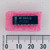 Top view of a National Semiconductor LM339N 14-pin DIP IC on pink foam with a metric scale.