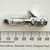 Side profile view of the ObtainSurplus PCRC-001 paracord roller clip next to a ruler.