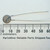 Unbranded 118OHM-PTC thermistor measured against a millimeter ruler.
