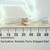 Unbranded 1/8 watt resistors with color bands aligned with a metric ruler.