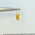 Rear view of yellow dipped tantalum capacitor showing K marking.