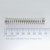 Century Spring W-40CS compression spring shown next to a millimeter scale ruler.