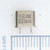 Front view of VARIOUS SS-9905 crystal oscillator showing stamped markings and wire leads.