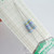 Close-up of two NTE 2WD47 flameproof resistors sealed inside packaging.