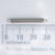 Century Spring S-527CS extension spring next to a millimeter scale.