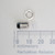 Disassembled PARTSMINE A-661 LED holder showing metal body, hex nut, and plastic insert next to a ruler.
