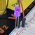 5mm ultraviolet LED glowing violet, inserted into a breadboard with connected power wires.