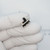 Angle view of PARTSMINE A-659 slide switch in gloved fingers.