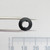Front aperture view of Parts Mine A-366 LED bezel held by tweezers.