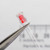 PartsMine A-6580 clear clip mounted onto a red LED.