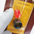 Close-up of red LED and mounting bezel in blister pack for Linrose Electronics B4382H1.