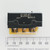 Side view of Micro Switch MS25008-1 showing stamped part numbers and terminal labels against a ruler.