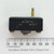 Side profile of MICRO SWITCH BZ-2RS-A2 with plunger actuator next to a metric ruler.