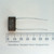 Ericsson-GE MPP5X 0.56uF 50VDC capacitor shown against a millimeter ruler.