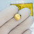 Top domed face of Clippard 11916-4 brass push button.