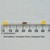Unbranded R-4.3ohm-CC axial resistor next to a millimeter scale.