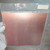 Reverse side of PartsMine 169316 copper clad board in clear packaging.