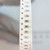 Strip of tape packaging showing Panasonic ERJ-8ENF3323V SMD resistors marked 3323.