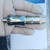 Side profile of Baumer 11245543 level sensor showing threads and tip.