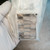 Valve interface face of SMC SY7000-27-2T subplate inside plastic bag.