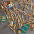 Close-up of gold-plated connector pins, wires, and RF hardware in the scrap lot.