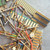 Close-up of gold-plated edge connector cards, pin headers, and contact pins.