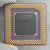 Underside view of Intel A80503166 SL27K processor showing gold pins and center markings.