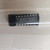 Close-up of Motorola MC14049U integrated circuit inside Archer 276-2449 packaging.