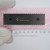 Top view of Microchip PIC18F452-I/P microcontroller IC resting on pink foam.