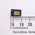 Broadcom AEDR-8320-1Q2 optical encoder in cut tape next to a millimeter ruler.
