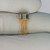 Side view of Microsystems International ML741CT showing metal can body and eight gold-plated leads.