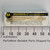 Vintage Motorola 2N1193 transistor in original sleeve alongside a millimeter ruler.