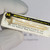 Gloved hand holding Motorola 2N1193 transistor in vintage foam and clear film package.