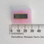 National Semiconductor DM8001N IC on pink foam next to a metric ruler for scale.