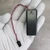 COMF SBH-421-1AS battery box held in a gloved hand for scale.