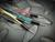 Multicolored male-to-male breadboard jumper wires with black plastic housings and silver pins on a dark textured surface.