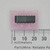 Top view of National Semiconductor CD4069CN DIP integrated circuit on ESD foam against a millimeter scale.