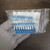 Plastic bag containing Murrelektronik 90975 jumper bridges and documentation.
