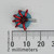 Top-down view of Digi-Key PA0689 inductor beside a millimeter ruler.