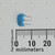 CSTLS8M00G53Z-B0 ceramic resonator shown with metric ruler for scale.