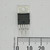 Front view of STMicroelectronics TDA2050 audio amplifier IC in Pentawatt package next to a millimeter scale.
