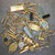 Assorted gold-plated electronic scrap components in lot 101526-130G.