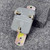 Rear view of Allen-Bradley X-206003 selector switch showing wiring terminals and electrical ratings.