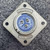 Rear view of Amphenol 97-3102A-16S-6S connector showing three solder cups and cast flange markings.
