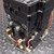 Side view of Square D 8502SEO1V03 contactor showing auxiliary contacts and base plate.