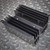Underside of the black anodized aluminum heatsink assembly.
